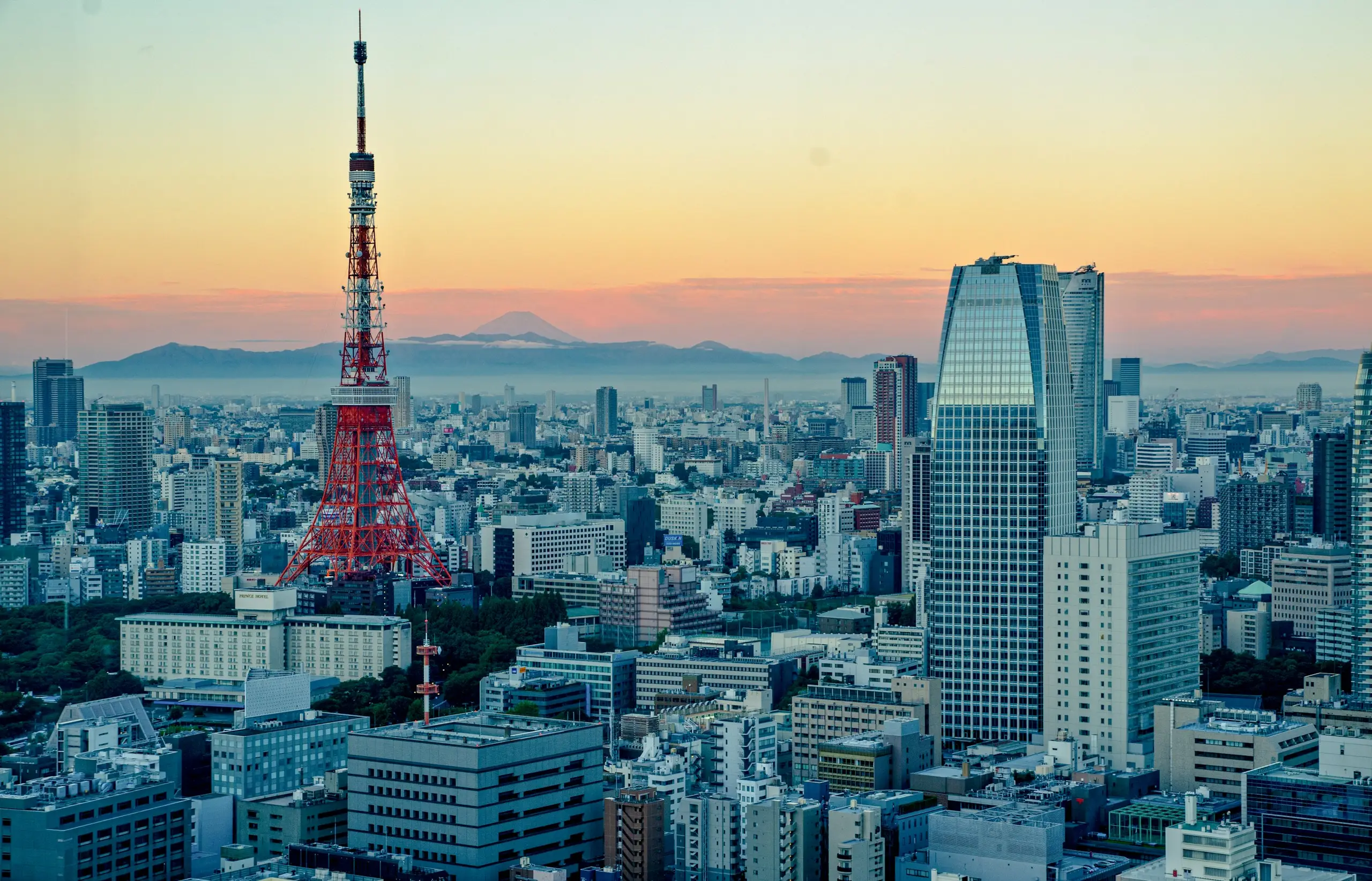 Tokyo Tower rising above the city skyline on a bright day